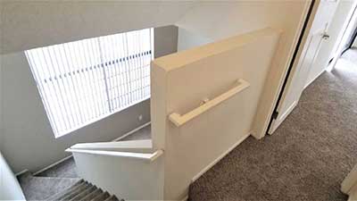 Broadway Apartments interior carpeted stairs